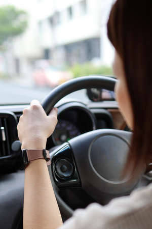 Behind a woman driving