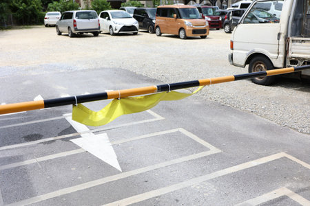 Pole at the entrance of the coin-operated parking lot