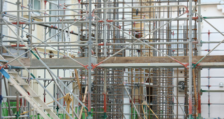 Site under rebar construction where scaffolding is builtの写真素材