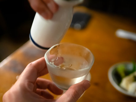 Drinking sake from a sake cupの写真素材