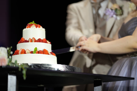 Bride and groom cutting the cake at a wedding