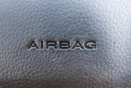 detail of the airbag device  on leather steering wheel Close-up / Car Handle Parts Airbagの写真素材