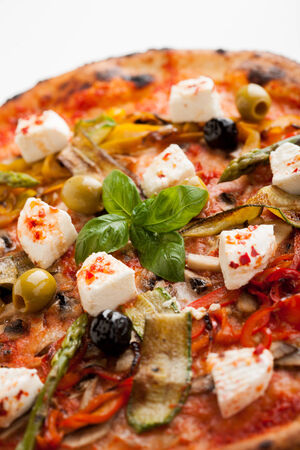 capricious pizza, tomato, olives, vegetables, fresh cheeseの写真素材