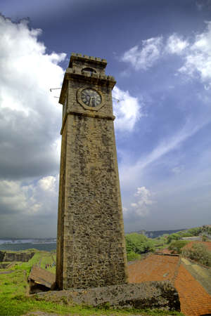The tower of the Galle Fort in front of a great blue cloudy skyの写真素材
