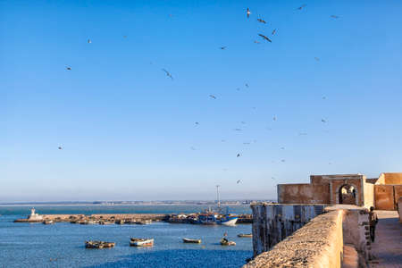 the old historic portuguese city El Jadida in Morocco at the coast of the shining blue Atlantic Ocean and a gorgeous old townの写真素材