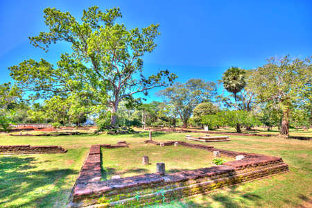 In the pilgrimage site of the old royal city Anuradhapura on the tropical Iceland Sri Lanka you find ruins of an old temple complex with baths, living and working places of buddhistic monks as well as ancient remains of gorgeous kings buildings and pagodaのeditorial素材