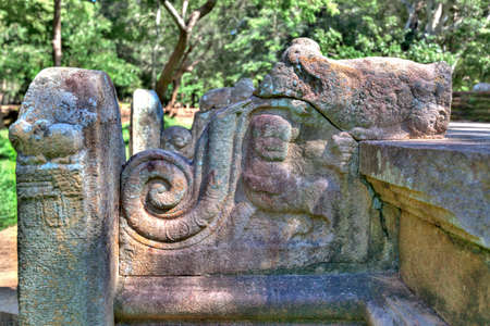 In the pilgrimage site of the old royal city Anuradhapura on the tropical Iceland Sri Lanka you find ruins of an old temple complex with baths, living and working places of buddhistic monks as well as ancient remains of gorgeous kings buildings and pagodaのeditorial素材