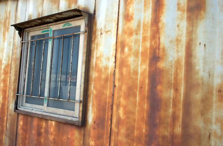 Window of a rusty building at a construction site - copy spaceの写真素材