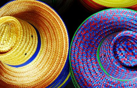 Colorful straw hatsの写真素材