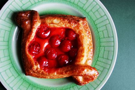 Cherry pastry on a green plateの写真素材