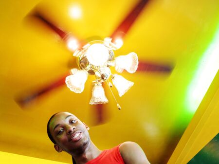 Jamaican man under a spinning lightの写真素材