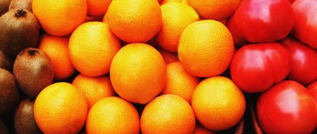 Kiwi fruit, oranges and tomatoesの写真素材