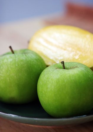Luscious fresh fruit - green apples and mangoの写真素材