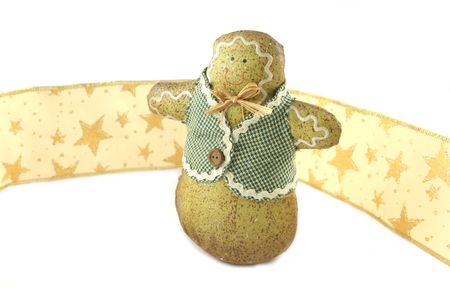 Gingerbread man against gold ribbon with stars - isolated