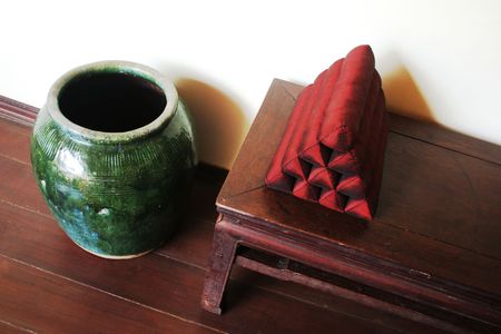 Large green vase and oriental pillow - home interiorsの写真素材