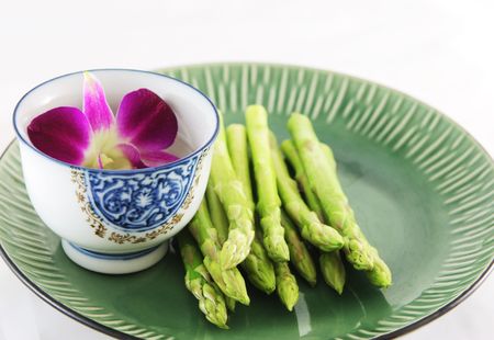 Fresh asparagus shoots on a plate - healthy livingの写真素材