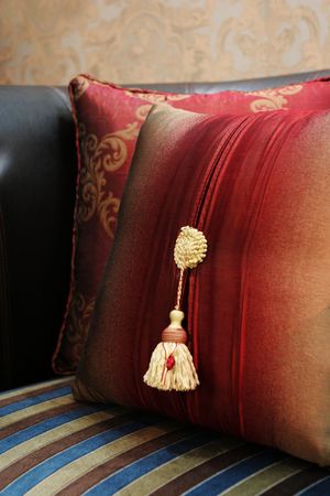 Close-up of a colorful cushion on a chair - home interiorsの写真素材