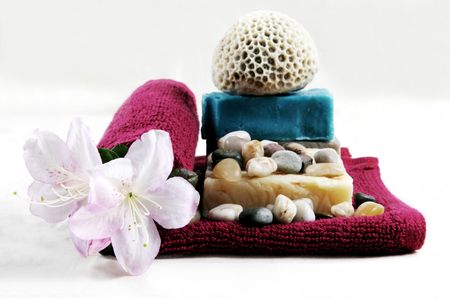 Coral, towel, flowers and soap isolated on whiteの写真素材