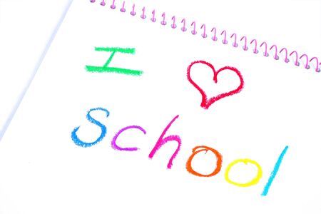 Notebook with the words "I love school" written in crayonの写真素材