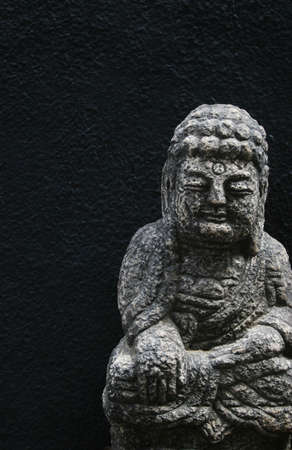 South Korean Buddha image taken on a black background - copy space.