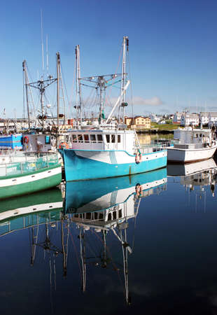 Boats moored at the wharf in Bonavista, Newfoundland, Canada - travel and tourism.
