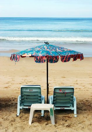 Deck chairs at the beach - summertime scenic.の写真素材