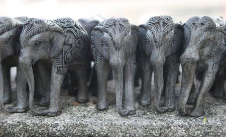 Row of silver engraved elephants.の写真素材