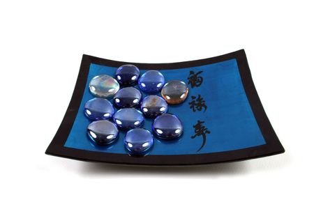 Oriental plate with blue healing stones - isolated.の写真素材