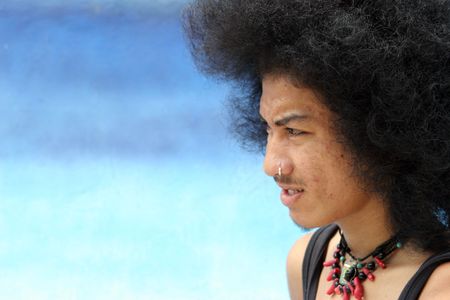 Close-up portrait of a young Thai man.
