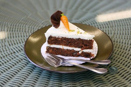 Delicious piece of carrot cake on a plate.の写真素材
