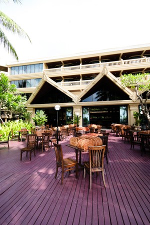 Table and chairs at a resort restaurant.のeditorial素材