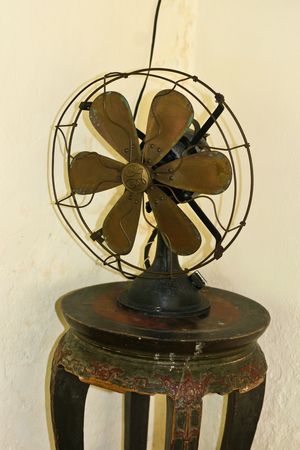 Old-fashioned fan on a table.の写真素材