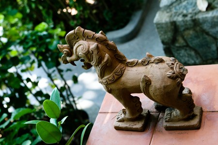 Thai statue in a garden - travel and tourism.
