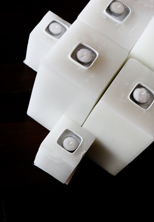 Set of white candles - isolated on black.の写真素材