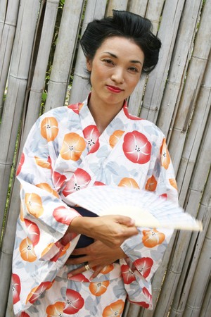 Portrait of a beautiful Japanese woman dressed in kimono.の写真素材