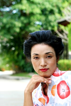 Portrait of a beautiful Japanese woman dressed in kimono.の写真素材