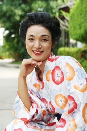 Portrait of a beautiful Japanese woman dressed in kimono.の写真素材
