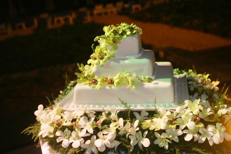 Wedding cake decorated with white orchids.の写真素材
