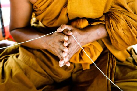 Close-up of a Thai monk at a temple in Thailand - travel and tourism.の写真素材