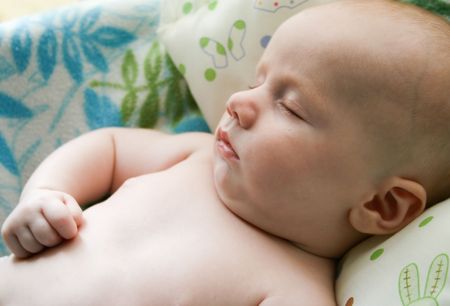 Portrait of a young baby fast asleep.