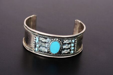 Silver bracelet with a turquoise stone.の写真素材