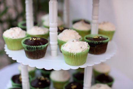 Wedding cake with cup cake style on a 3-tiered tray.の写真素材