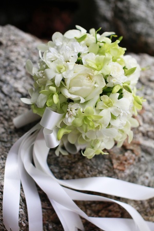 Beautiful wedding bouquet of white orchids and roses.の写真素材