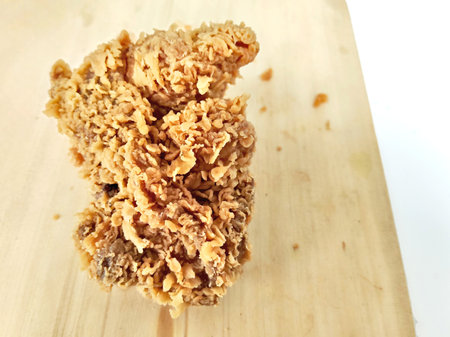 Crispy fried chicken on wooden board. Selective focus.の写真素材