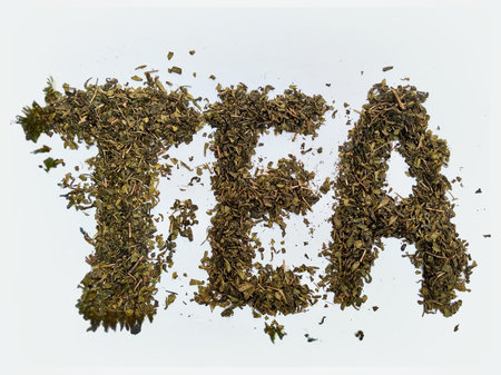 The word Tea written with dry green tea leavesの写真素材