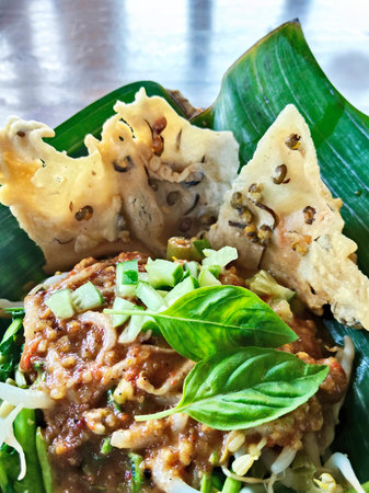 Thai noodle on banana leaf with fish ball and spicy sauce