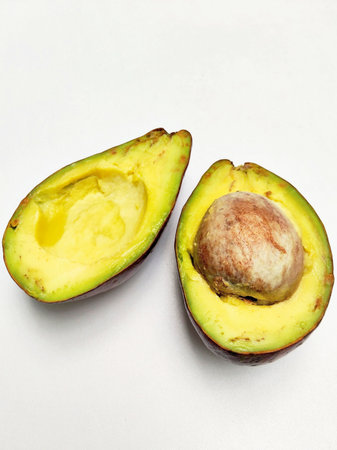Avocado on a white background. Avocado cut in half.