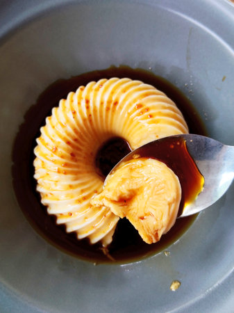 Delicious and Refreshing Milk Pudding Dessert on Spoon