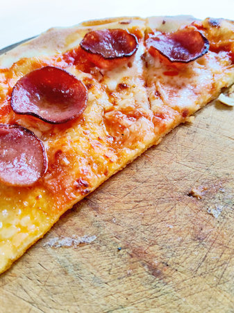 Pizza with pepperoni on wooden board, selective focus.の写真素材