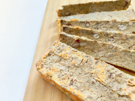 Rustic Food Photography: Traditional Sundanese Oncom-Based Sweet Treat or Snack with Almonds.の写真素材